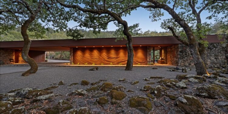 Lawrence Simons designed this 1982 Santa Rosa residence around massive granite outcroppings, and it has huge windows overlooking the Valley of the Moon.