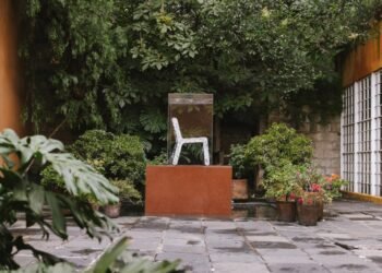 Recycled-plastic plinths hold furniture at "secret" Barragán house in Mexico City