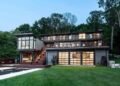 Contemporary lake house set into a steep wooded hillside overlooking Lake Geneva, Wisconsin